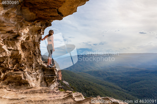 Image of Cliff side cave with  mountain valley views