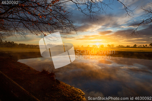 Image of Ground fog creeps across the landscape on Autumn morning 