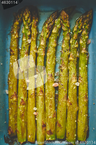 Image of Close up with selective focus on roasted asparagus seasoned with