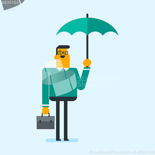 Image of Caucasian insurance agent standing under umbrella.