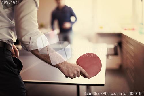 Image of startup business team playing ping pong tennis