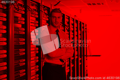 Image of young it engeneer in datacenter server room