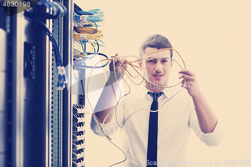 Image of young it engeneer in datacenter server room