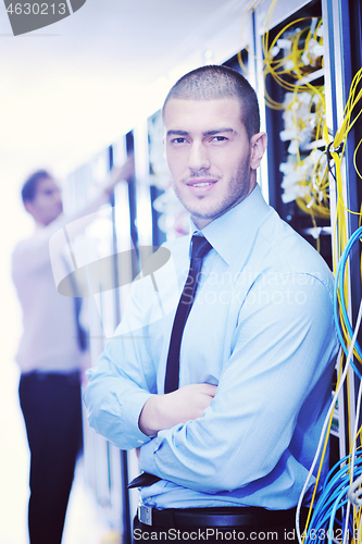 Image of it engineers in network server room