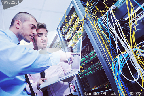 Image of it enineers in network server room