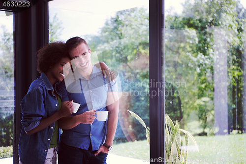 Image of romantic happy young couple relax at modern home indoors