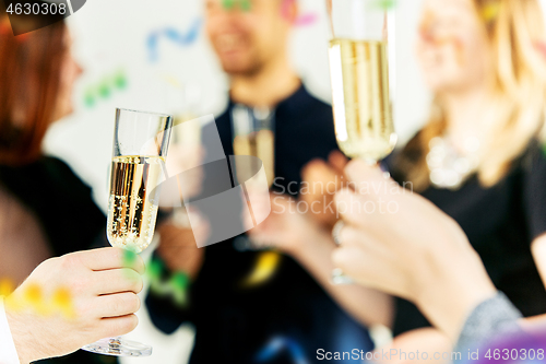 Image of Celebration. Hands holding the glasses of champagne and wine making a toast.