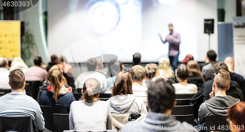 Image of Business speaker giving a talk at business conference event.