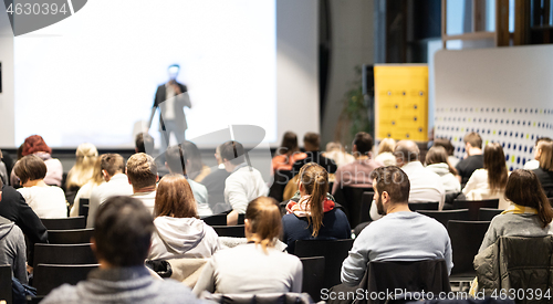 Image of Business speaker giving a talk at business conference event.