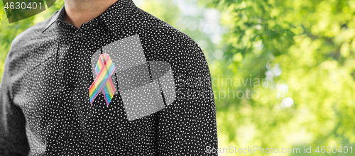 Image of man with gay pride rainbow awareness ribbon