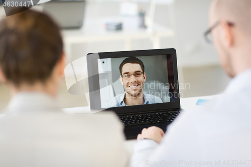 Image of business team having video conference at office