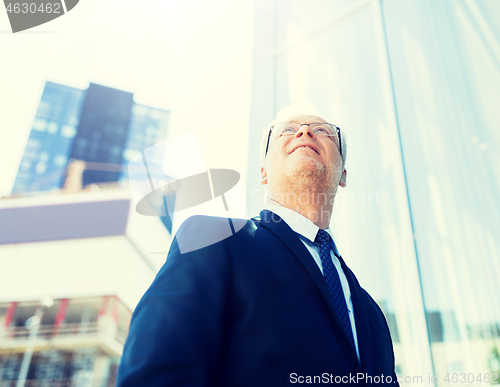 Image of senior businessman on city street