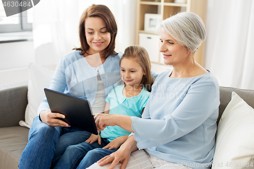 Image of mother, daughter and grandmother with tablet pc