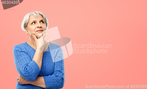 Image of portrait of senior woman in blue sweater thinking