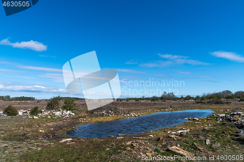 Image of Water hole in a great barren landscape