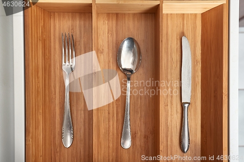 Image of Minimalist kitchen tools put away in a drawer