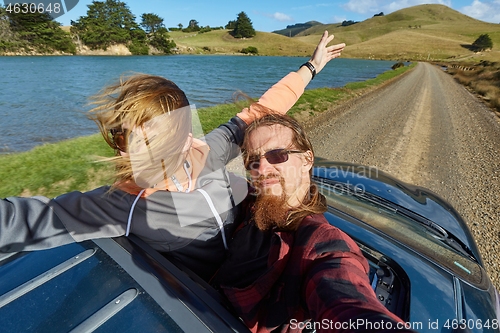 Image of Car journey enjoying sunroof in the countryside