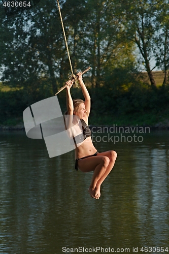 Image of Rope swing river jump