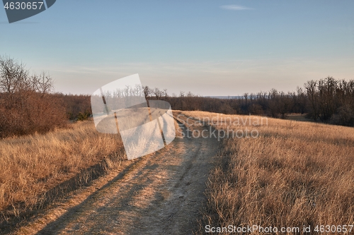 Image of Countriside dirt road landscape, pale autumn