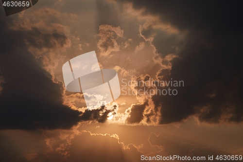 Image of Sunset through cloudy dramatic sky