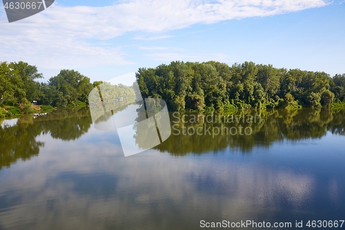 Image of Peaceful waters of rivers merging, summer landscape