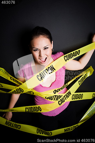 Image of Businesswoman trapped in caution tape