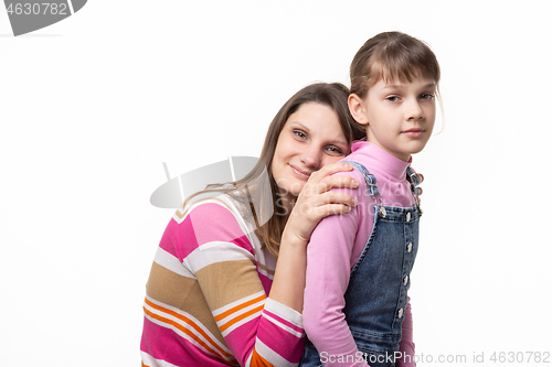 Image of Happy mother put her head on her daughters back, isolated on white background