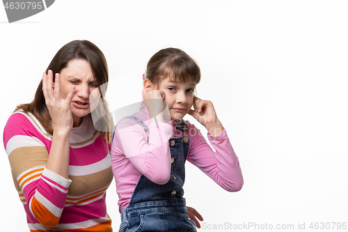Image of Girl sneezes, child plugged ears, isolated on white background