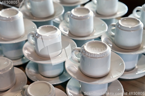 Image of Clean coffee cups piled up