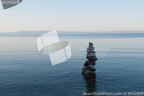 Image of Balance stone pyramid on the sea coast