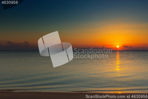 Image of sunrise on sand beach