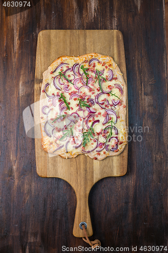 Image of Flammkuchen - Traditional French dish tarte flambee cream cheese, bacon and onions