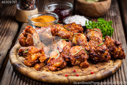 Image of Hot chicken wings with different spices and dips