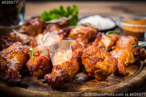 Image of Hot chicken wings with different spices and dips