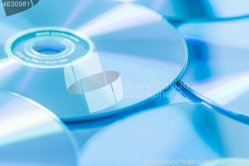 Image of Stack of CD or DVD in blue tone as background