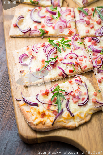 Image of Flammkuchen - Traditional French dish tarte flambee cream cheese, bacon and onions