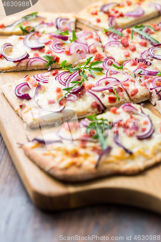 Image of Flammkuchen - Traditional French dish tarte flambee cream cheese, bacon and onions