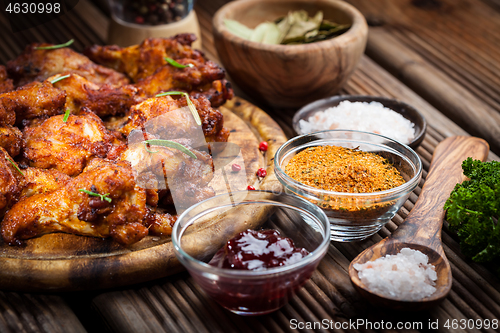 Image of Hot chicken wings with different spices and dips