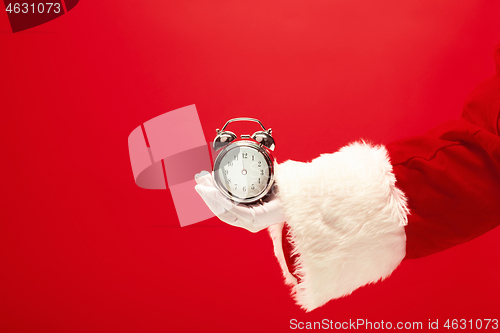 Image of Santa holding an old alarm clock