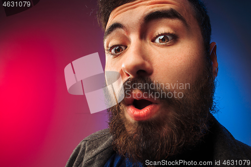 Image of The young attractive man looking suprised