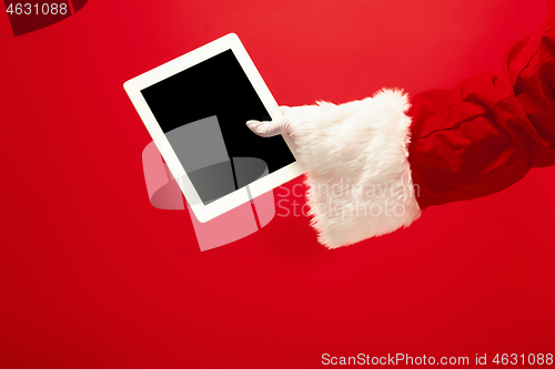 Image of Santa Claus holding laptop