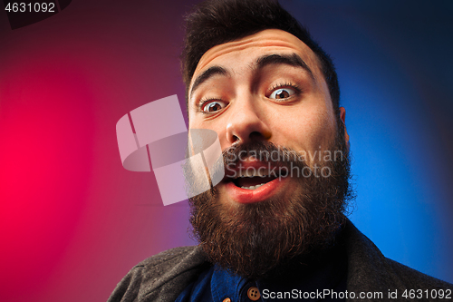 Image of The young attractive man looking suprised