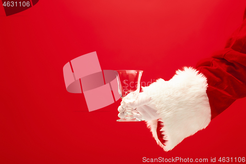 Image of Santa Holding Champagne wineglass over red