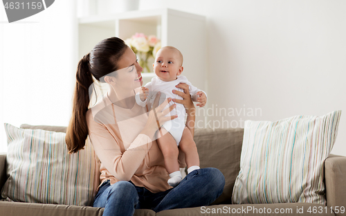 Image of happy mother with little baby boy at home