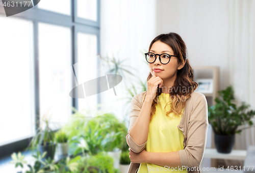 Image of asian woman in glasses or student at home