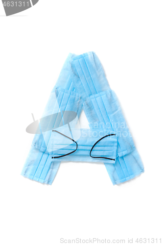 Image of Letter A made from protective medical masks on a white background.