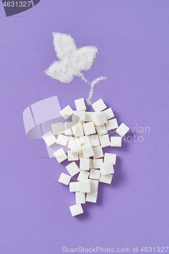 Image of Refined sugar cubes as a grape fruit with leaf from granulated sugar.