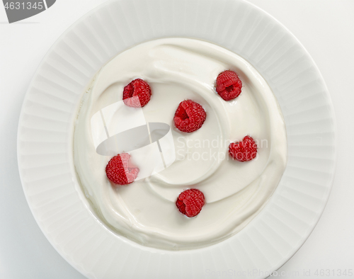 Image of plate of greek yogurt with raspberries