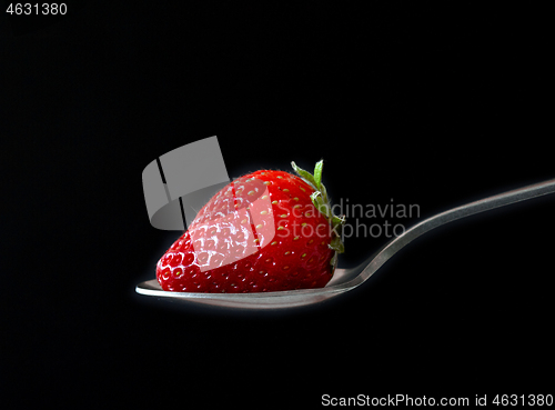 Image of fresh ripe strawberry on black background