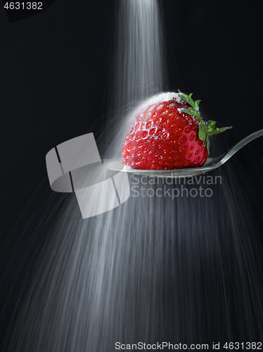 Image of fresh ripe strawberry on black background